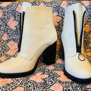 White zip-up ankle boots